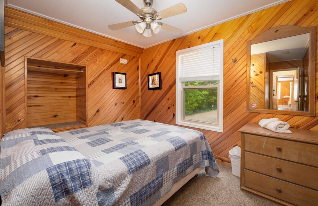 Bedroom of the Chalets at Ozark Outdoors Riverfront Resort