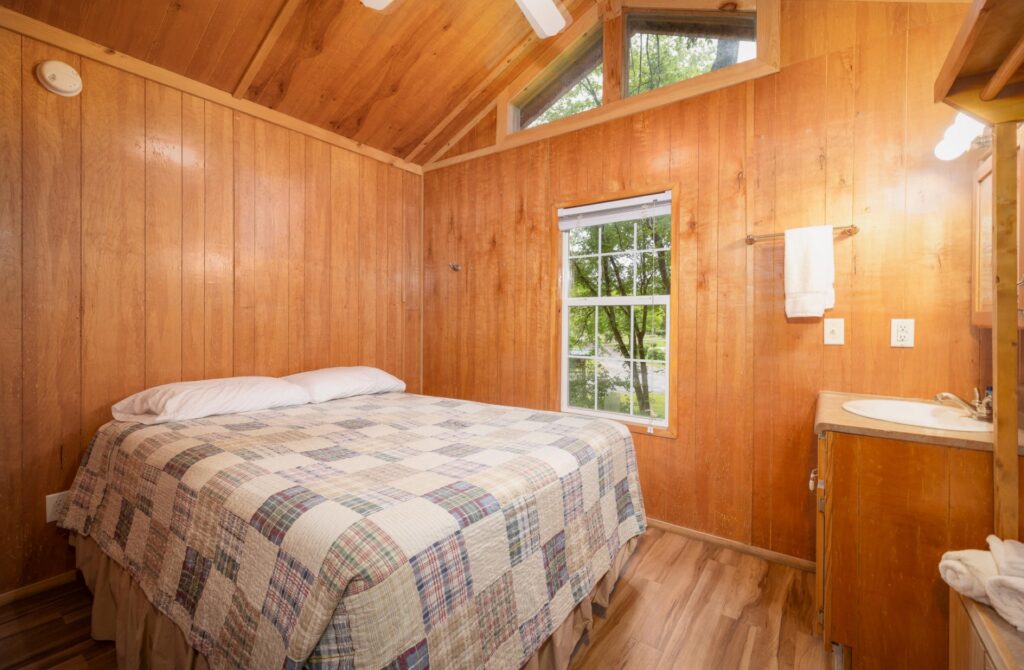 Bedroom of the Deluxe Kozy Kabin at Ozark Outdoors Riverfront Resort