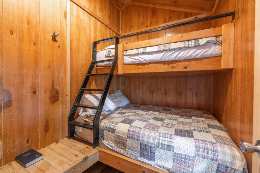 Bedroom of the Deluxe Kozy Kabin – Pet Friendly at Ozark Outdoors Riverfront Resort