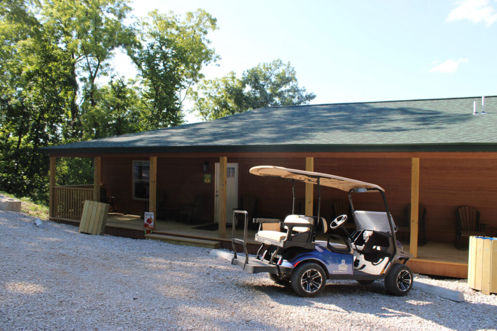 Lookout Lodge exterior with its long covered porch and Adirondack chairs