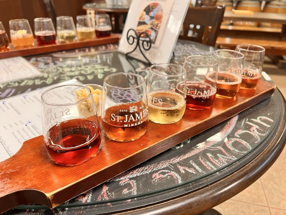 Wine flight of six glasses on a wooden paddle at St. James Winery